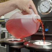 liquid being poured into machinery